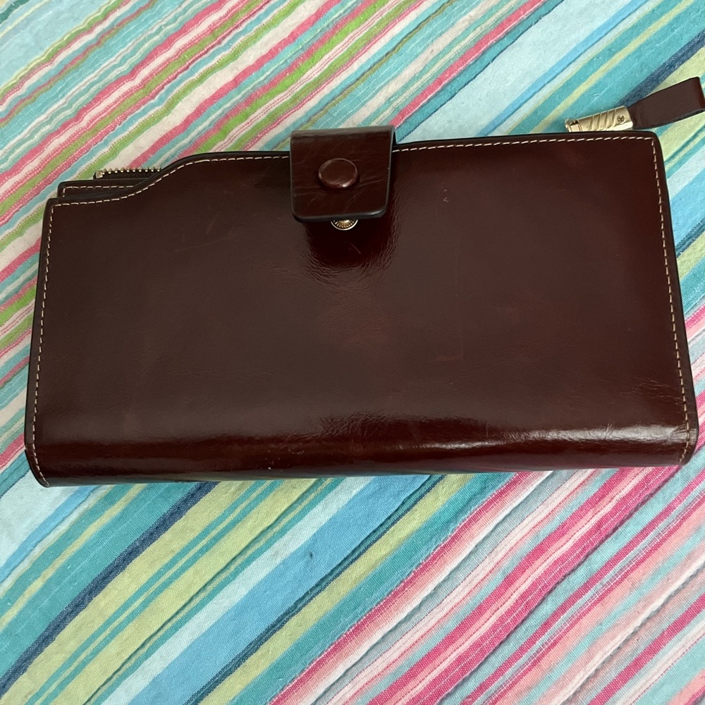 Bought this wallet from Amazon, in excellent condition, 7 inches across, brown,